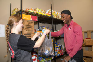students packing food bags