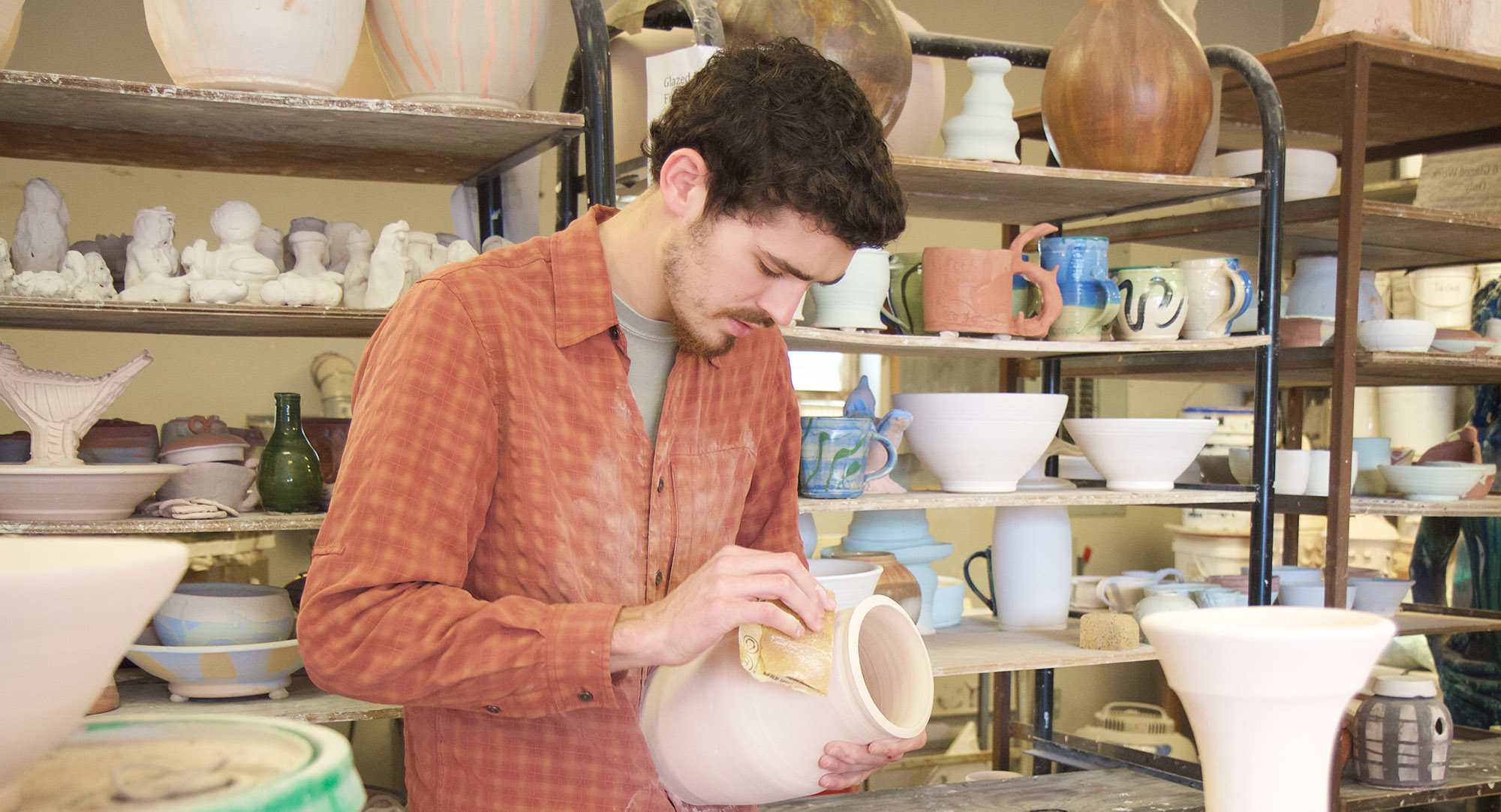 Art Stewart working on pottery vase