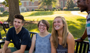 Bekah Rhea with students on campus