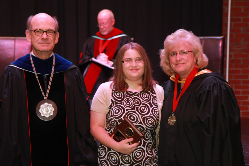 Chasity McCraw, center, receives an award from former GWU President Dr. Frank Bonner, left, and Assistant Professor of Mathematics Tammy Hoyle, right.