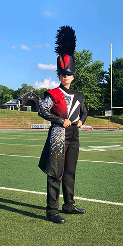 student in marching band uniform