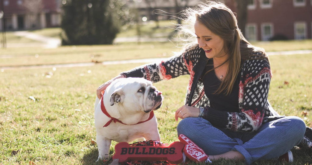 A GWU student pets Roebuck, the GWU Bulldog.