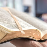 A man holding a Bible