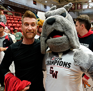 student with mascot