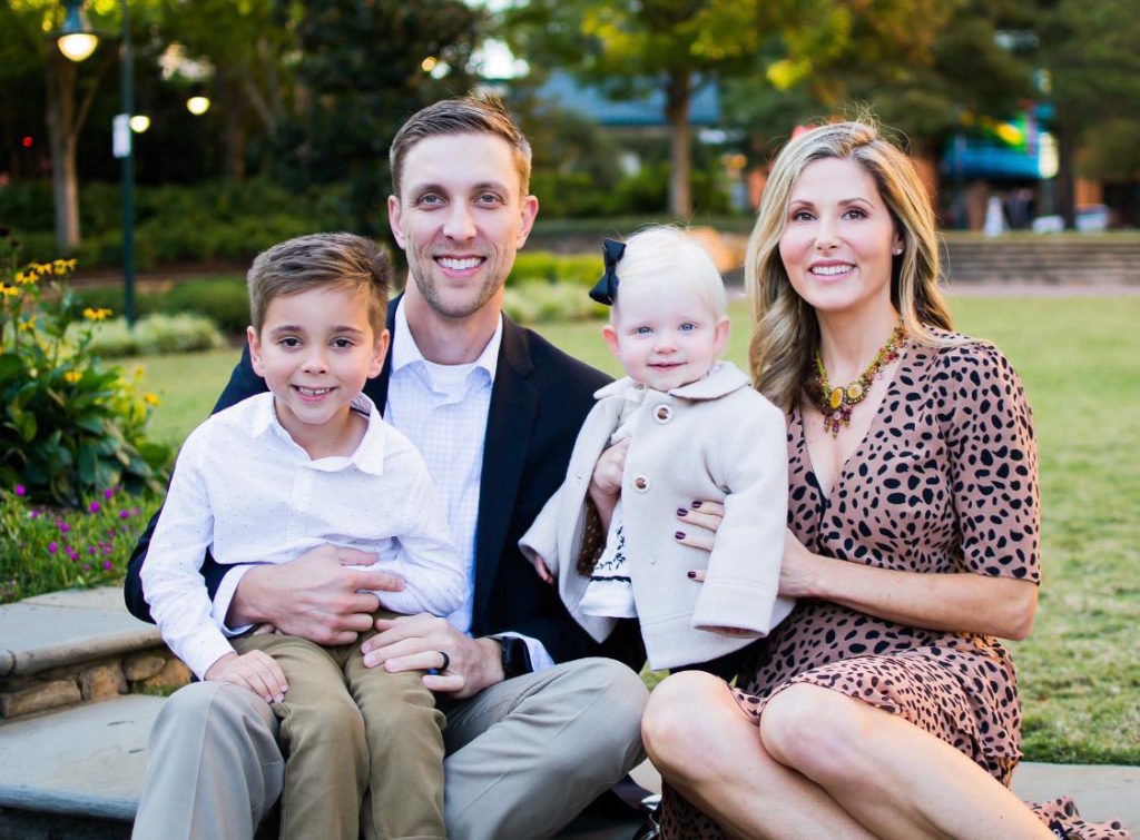 Trey Miller with his wife and children
