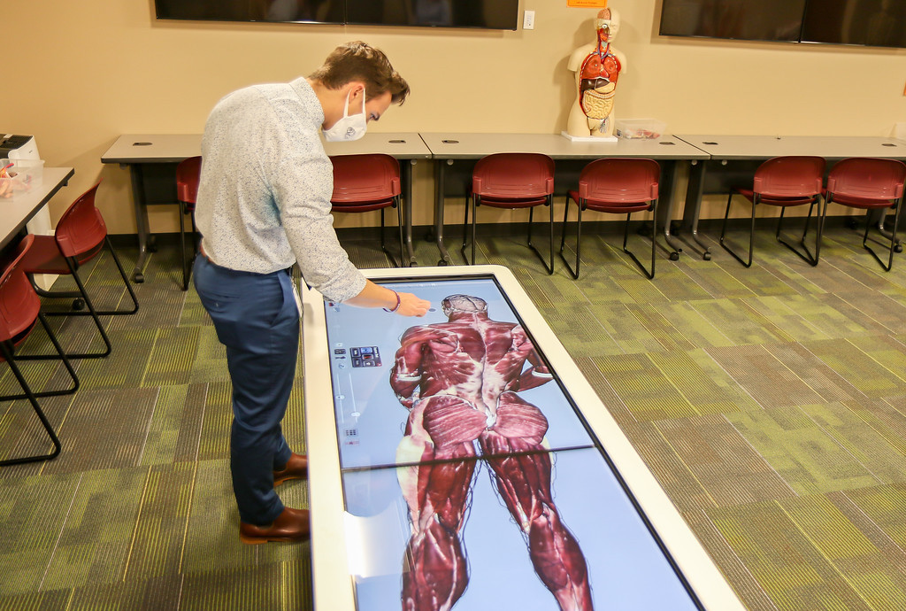 Ethan Garris studies anatomy with GWU's state-of-the-art Anatomage Table.