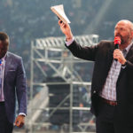 Clayton King on stage with another pastor