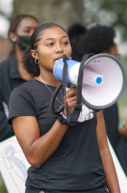 JeNai Davis speaking at rally
