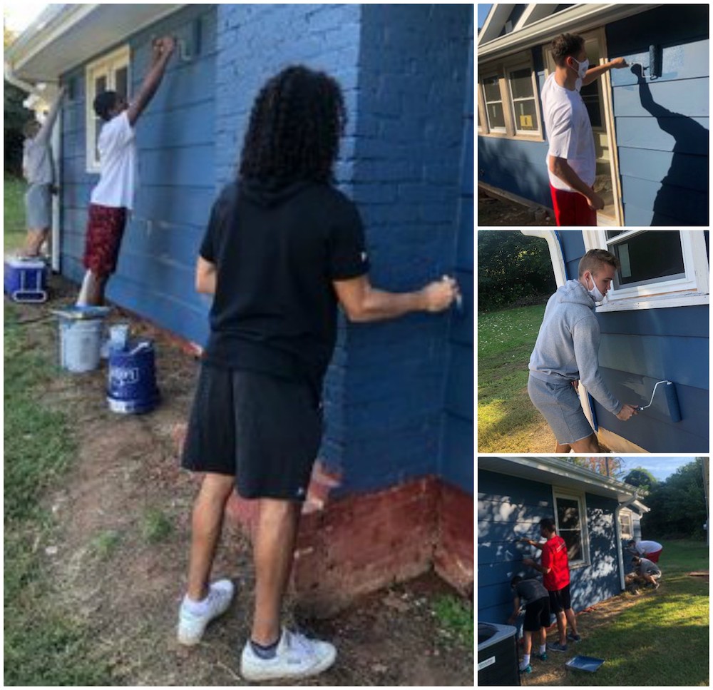 Members of the Men's Basketball Team painted a house for Rutherford Housing Partnership