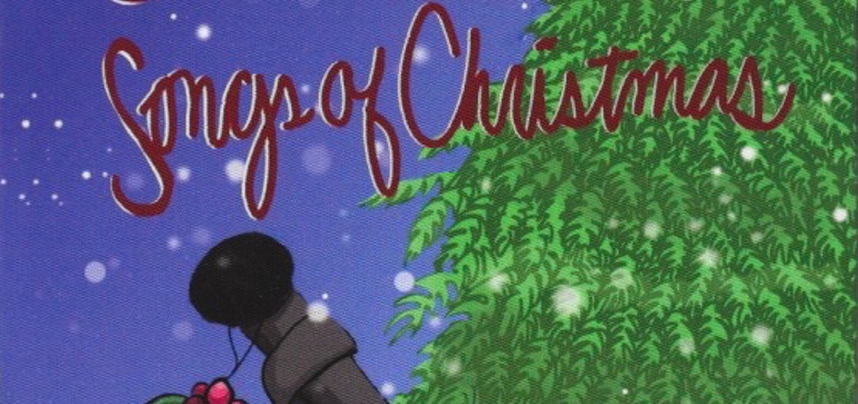 An image from the Songs of Christmas CD cover that has a pine tree, microphone with mistletoe and snow falling
