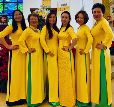 Thanh-Thuy T. Nguyen, first one on the left, poses with her church choir in traditional Vietnamese dress.