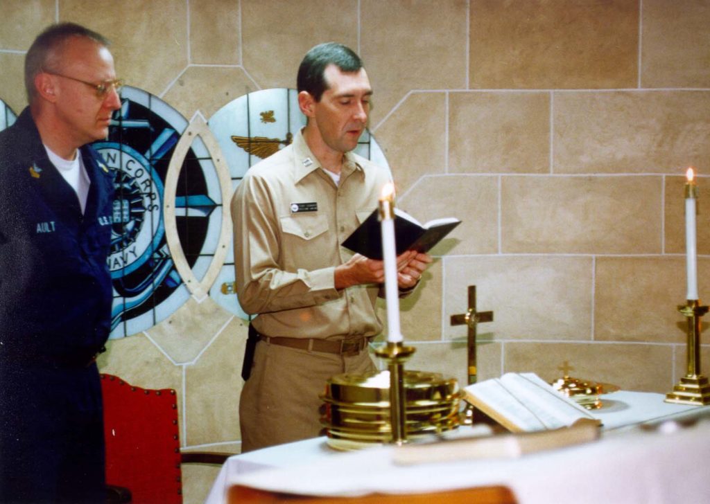 Terry Eddinger leads a Christmas service while serving on the USS John F. Kennedy.