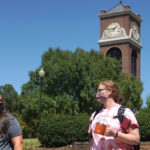 Students social-distanced across campus doing their part wearing masks, sanitizing, and encouraging one another.