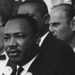 a historical photo of Dr. Martin Luther King Jr. at the march on Washington, D.C.