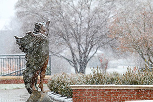 Aurora Statue in the snow on campus