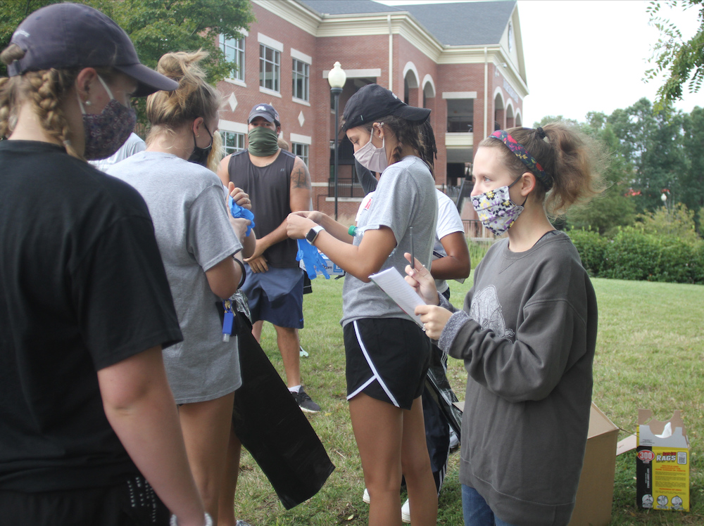 Students gathered together to clean campus