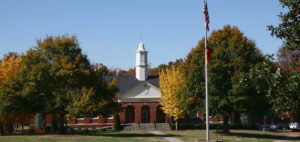 a photo of Craig Hall with the flag pole in front