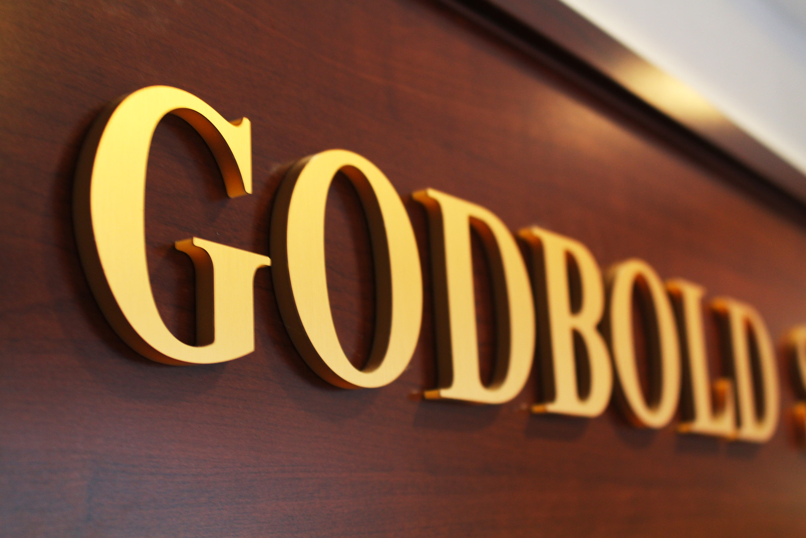 a photo of the Godbold sign in the School of Business