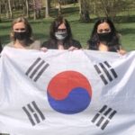 GWU's Model UN Team holds the flag of the Republic of Korea