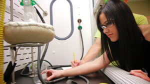 female student at science lab