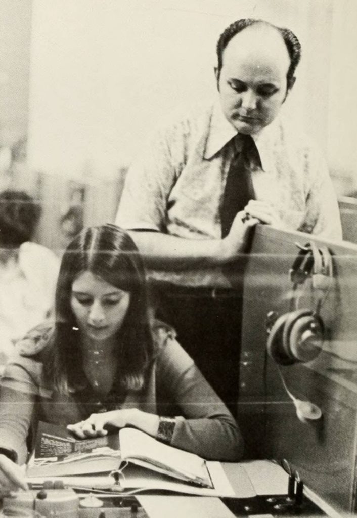 A photo of Dr. Robert Moore observing a student in a lab at Gardner-Webb. 