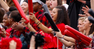 students cheering at a football game