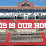 A screenshot of the video, with the title This is Our House printed over a picture of Spangler Stadium