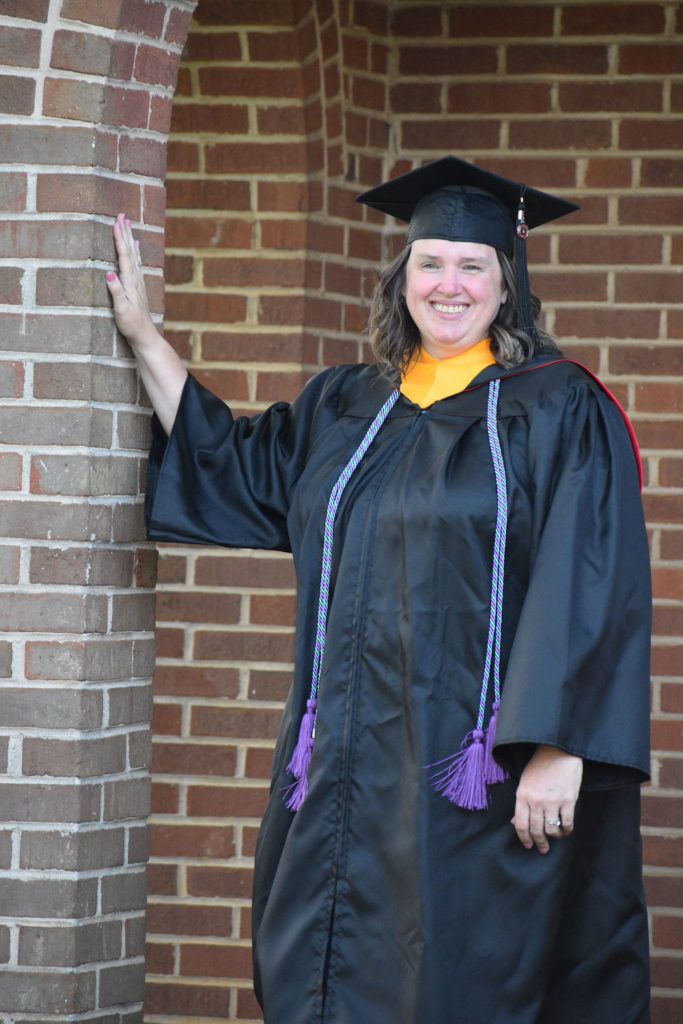 Melissa Ramsey poses in her GWU cap and gown. 