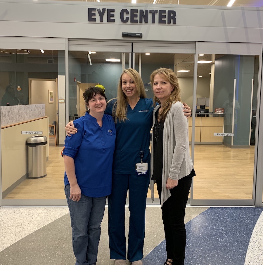 Dr. Jessica Cameron, center, poses with her co-workers, Genie (left) and Julie (right) on the eye clinic's opening day.