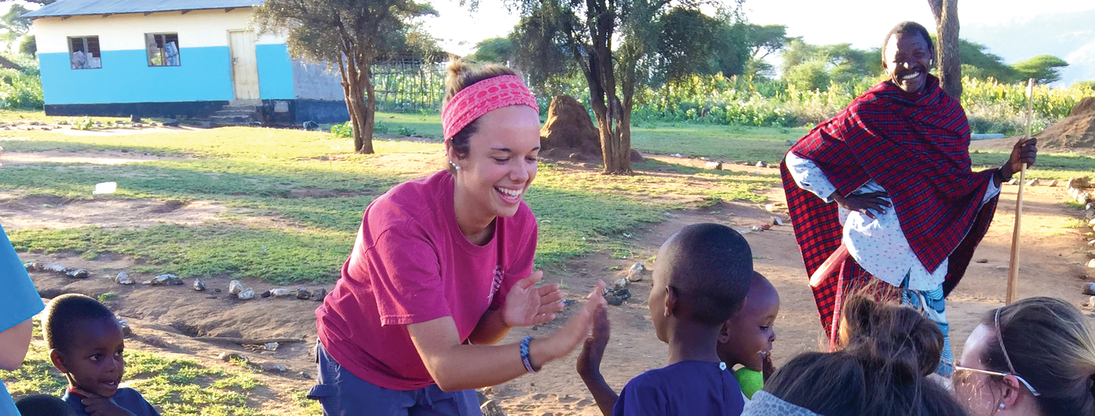 GWU student playing with local boy on mission trip