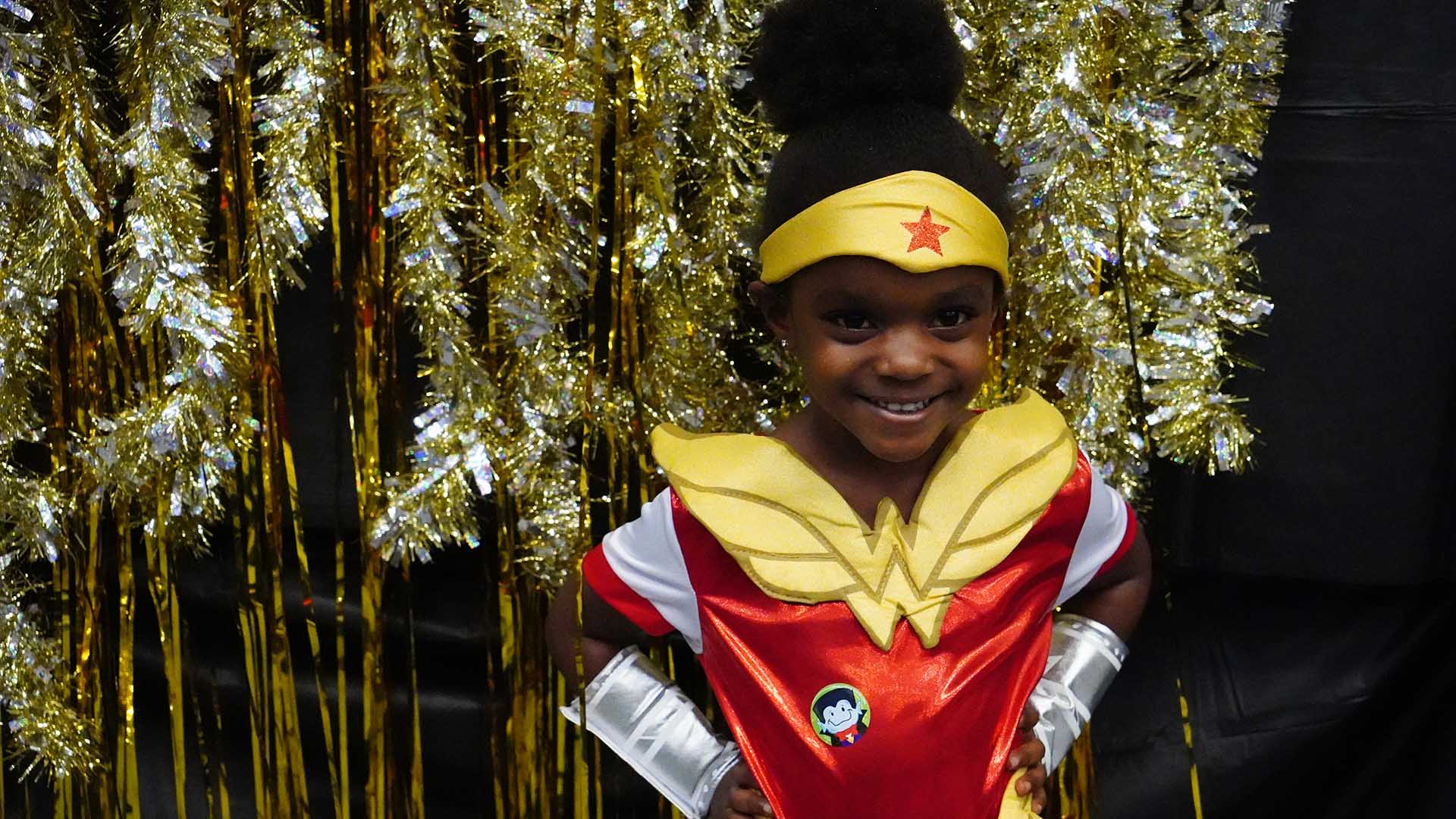 Little girl in wonder woman costume at GWU Octoberfest 2019