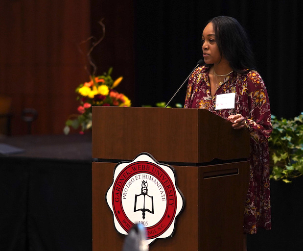 Aliah Price speaks at the Distinguished Alumni brunch.