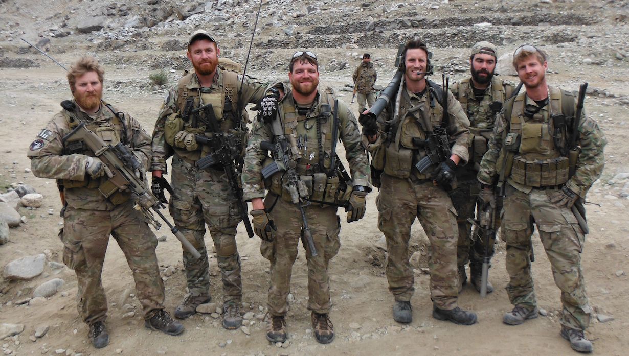 A group of soldiers in Afghanistan, with Jerry Gass is in the middle.