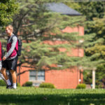 students walking across campus