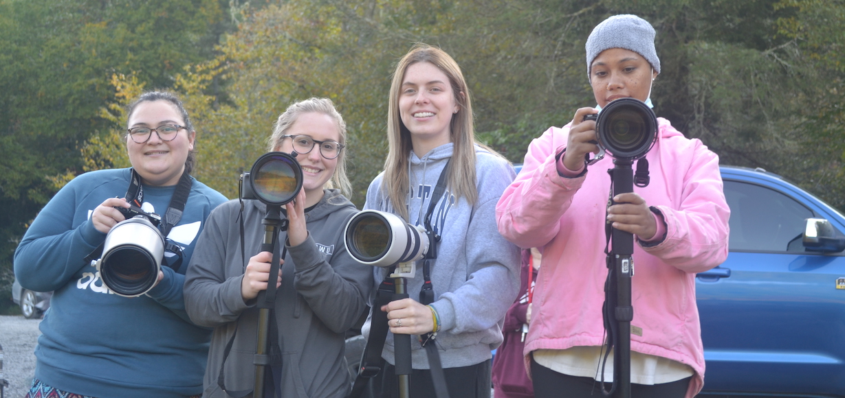 From left, Kalyn Wilson, McKenzie Trantham, Kelsie Burke, and Victoria Young hold cameras getting ready to take pictures of elk in their habitat