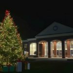 a photo of the lighted Christmas tree in front of Tucker Student Center