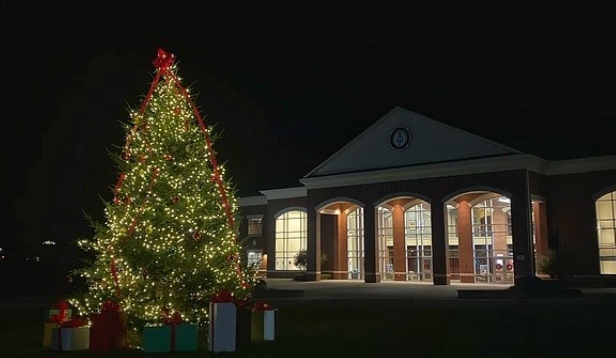 a photo of the lighted Christmas tree in front of Tucker Student Center