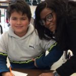 Jackie Grace works with a student in her classroom