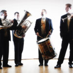 The six members of Carolina Brass pose with the instruments