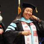 Dr. Kim Williams-Roberts receives her hood at the December 2021 Graduation Ceremonies.