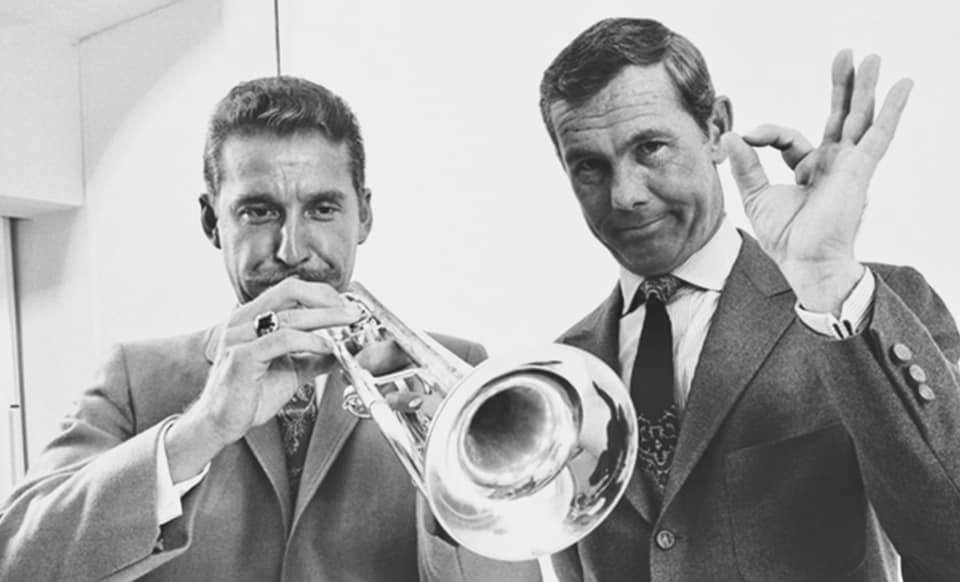 A black and white photo of Doc Severinsen, left, and Johnny Carson