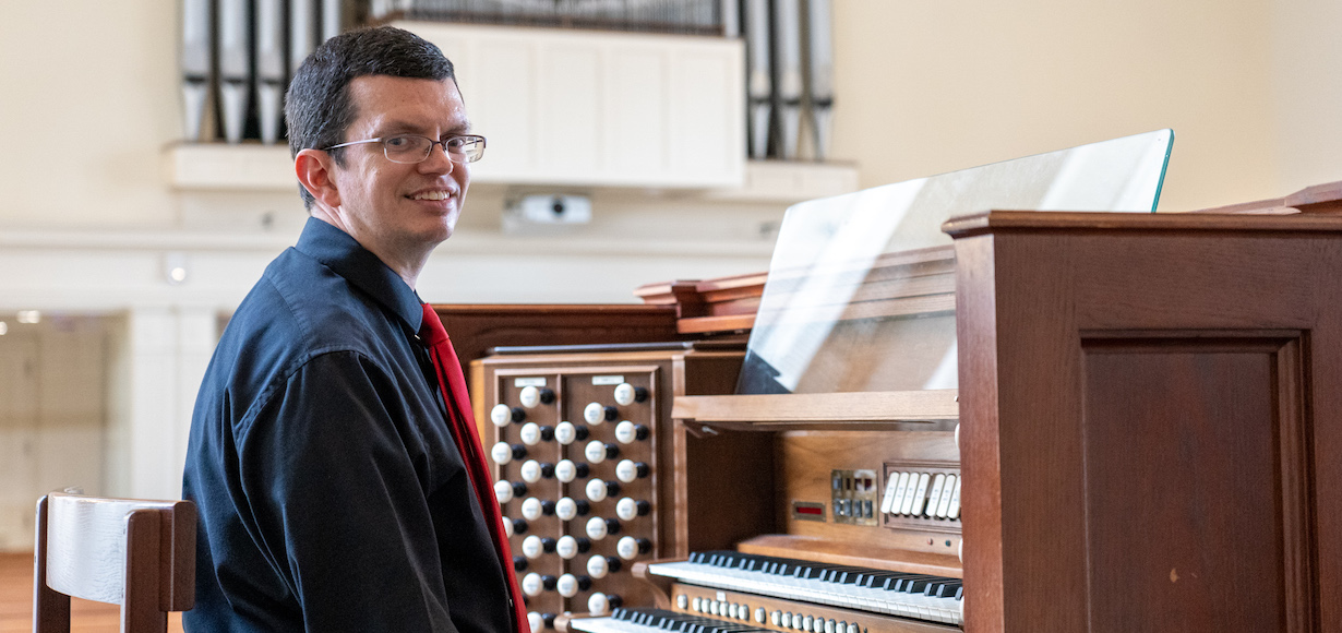 Gardner-Webb University accompanist Timothy Scruggs prepares to play the organ in the Dover Chapel.