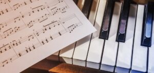 sheet music laying on a keyboard