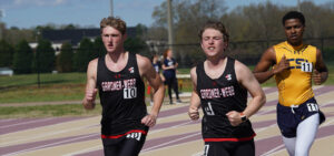 Cole Ray, no. 4, runs in a race at Winthrop University. A Gardner-Webb teammate is on the right and another competitor is on his left.