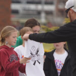 A young fan receives a T-Shirt at Youth Day