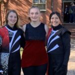Lauren McIntyre, center, and two band members