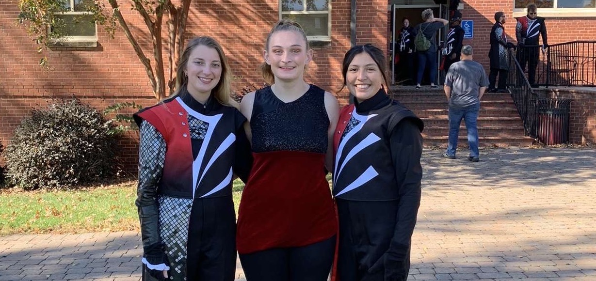 Lauren McIntyre, center, and two band members