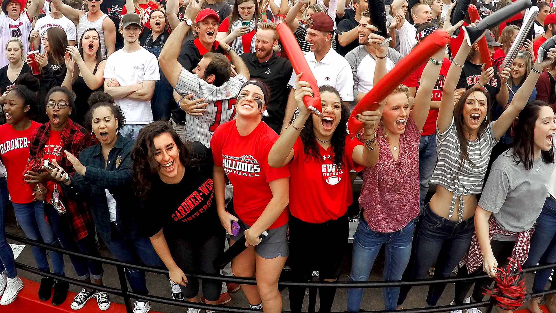 gwu students in football stands cheering