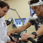 a student conducts a test with another student in the exercise science lab