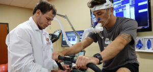 a student conducts a test with another student in the exercise science lab